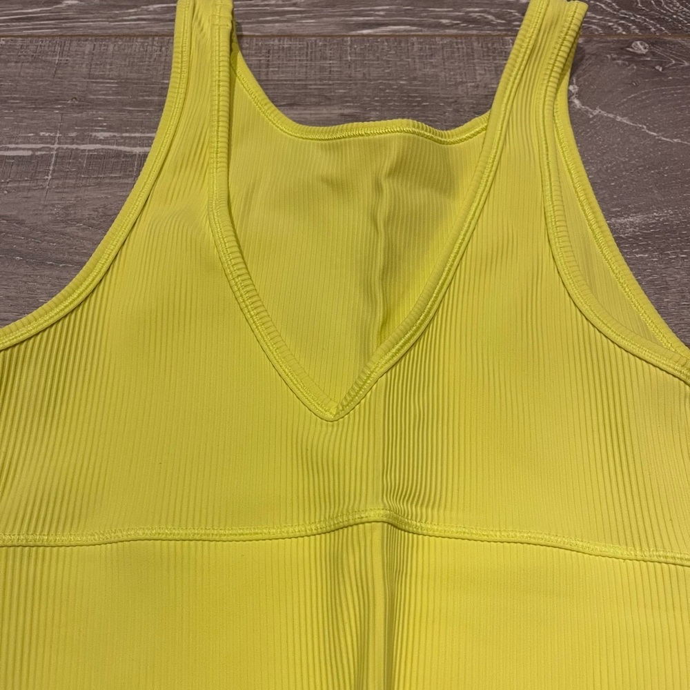 Neon yellow Lululemon sports bra